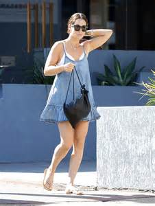 erin mcnaught flaunts her trim pins in short denim frock daily mail