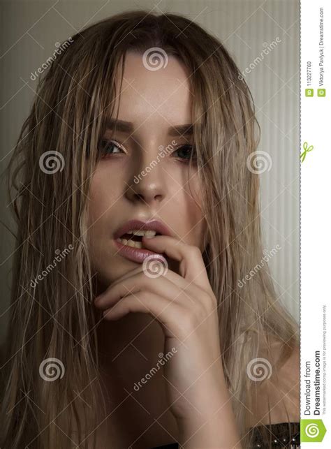 Fashion Portrait Of Blonde Woman With Long Wet Hair And