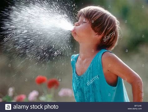 boy  spitting  water stock photo  alamy