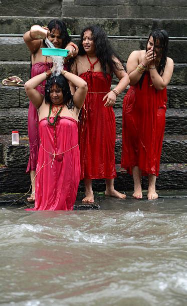 nepalese hindu women take a ritual bath in the bagmati river during the