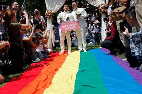 taiwan celebrates asia s first same sex marriages as