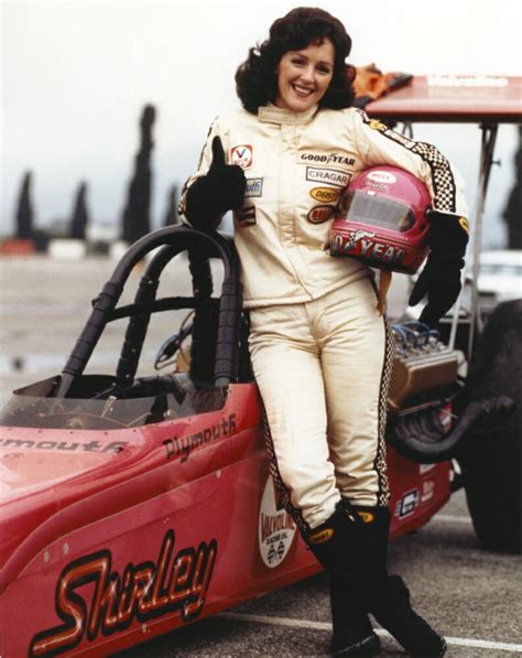 posterazzi bonnie bedelia posed  car racing outfit carrying