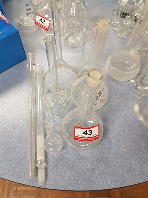 assorted laboratory glassware including beakers quantity of 8 and 2 tubes