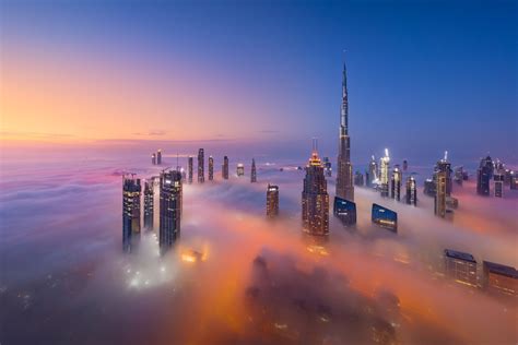 photographer captures skyscrapers  dubai rising   clouds petapixel