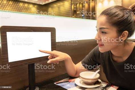 Beautiful Asian Woman Pointing Her Fingers On The Monitor Screen Stock