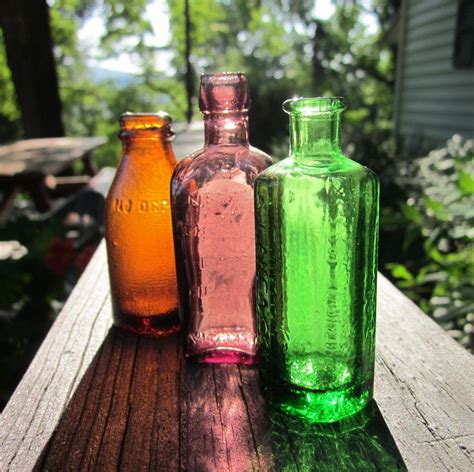 Three Miniature Colored Glass Bottles