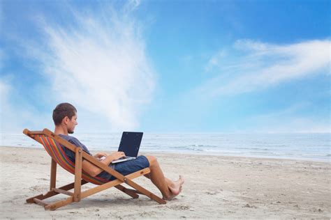 businessman working  computer   beach gomez  moreno asesores