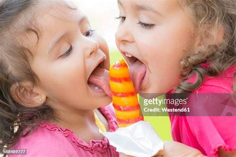 girl eating popsicle photos and premium high res pictures getty images