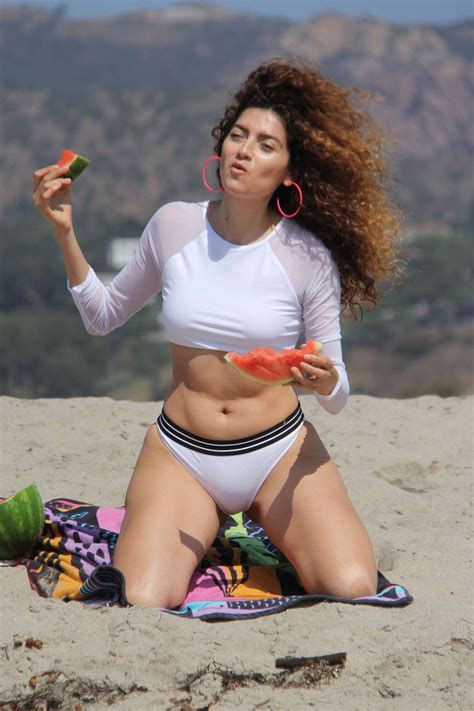 blanca blanco doing a photo shoot on the beach in malibu