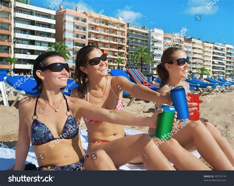beautiful young girls drinks  beach stock photo  shutterstock