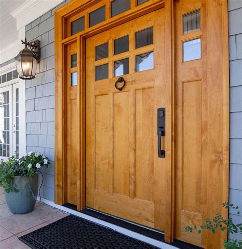 stained wood front door  sidelights  transom gray blue cedar shake siding tile floor