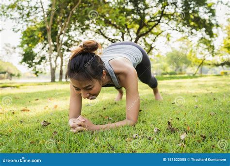 Healthy Young Asian Runner Woman Warm Up Her Body By Push Up Before