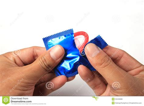man s hands unwrapping a condom royalty free stock image image 35445686