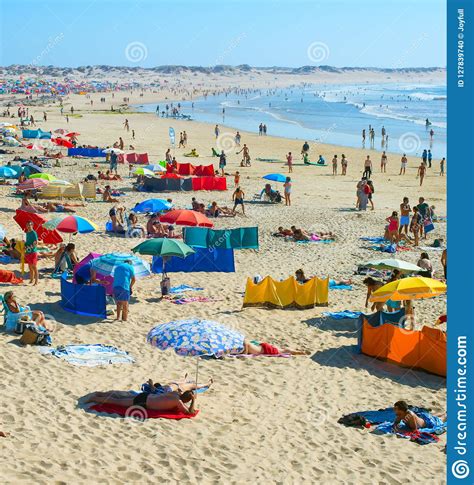 people rest ocean beach portugal editorial image image  beautiful beach