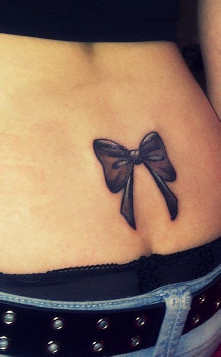 Simple Lower Back Bow Tattoo With White Highlighting