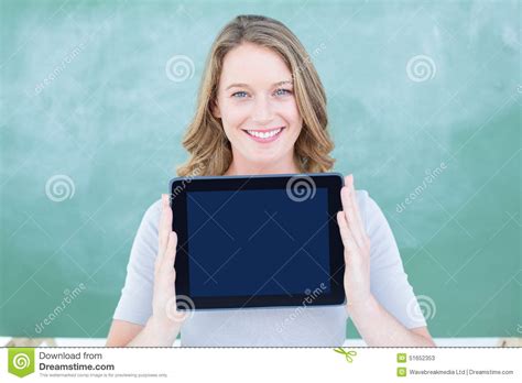 smiling teacher holding tablet pc  front  blackboard stock image image  fair light