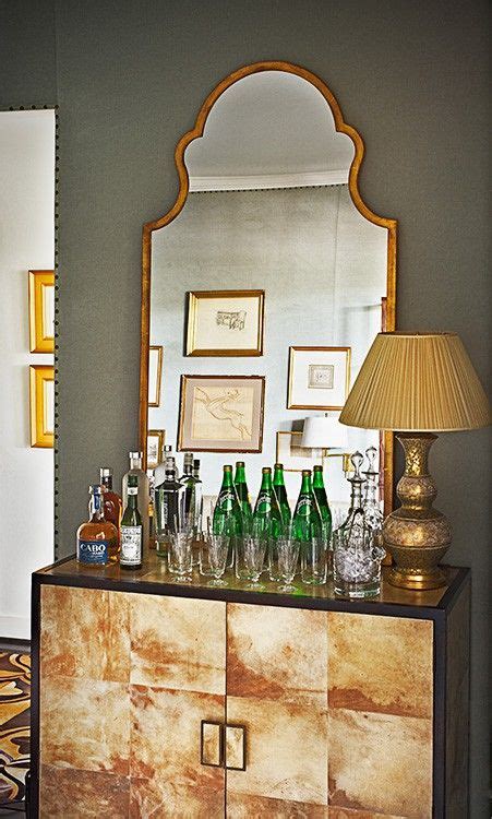 i spy nailhead trim great wall color and a fantastic mirror sideboard that add up to a phenom