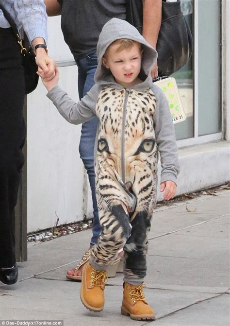 january jones shops in la with her leopard onesie clad son