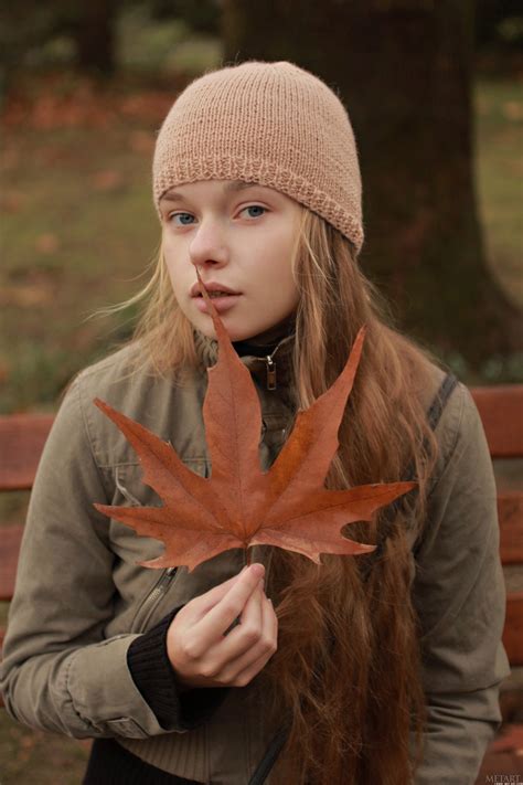a ukrainian girl named milena posing with a leaf