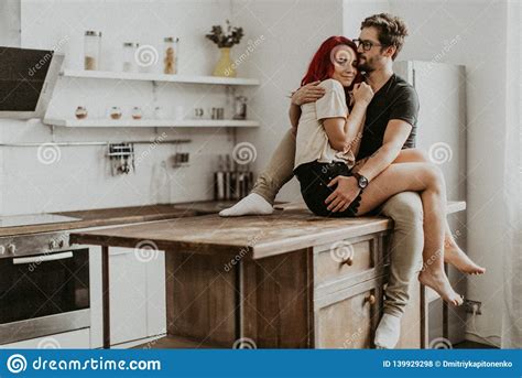 Authentic Beautiful Loving Couple Are Kissing And Hugging In The