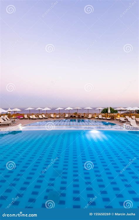 luxury swimming pool  sunrise  hotel resort rhodes greece stock