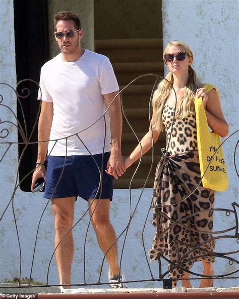 paris hilton slips into a sexy leopard swimsuit to hang by the pool