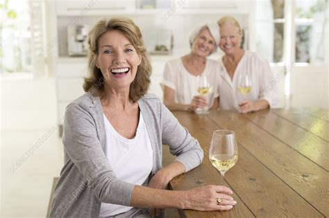Smiling Senior Women Drinking White Wine Stock Image F014 0857