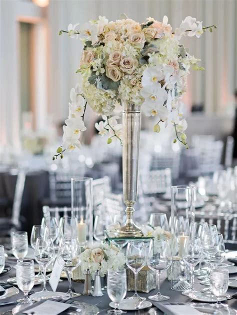 classic tall wedding centerpiece  white roses hydrangeas