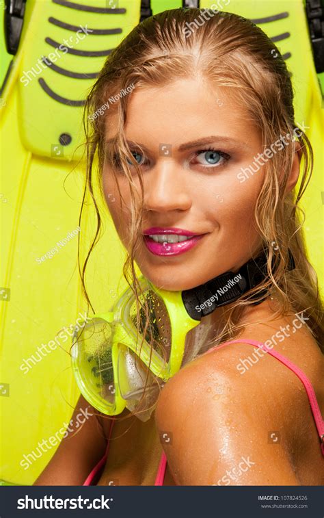 Beautiful Sexy Woman In Pink Bikini With Scuba Mask On Green Background