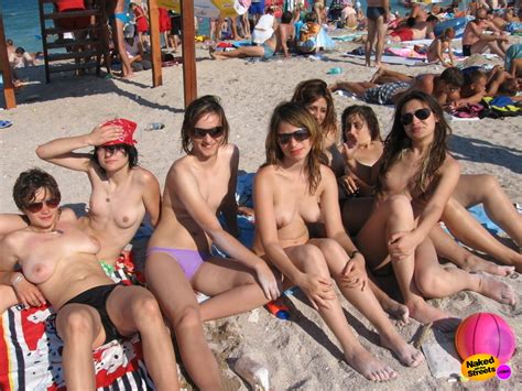 group of topless teens at beach