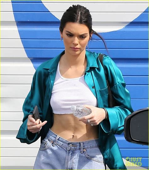 kendall jenner flaunts abs in high waisted jeans and crop top photo