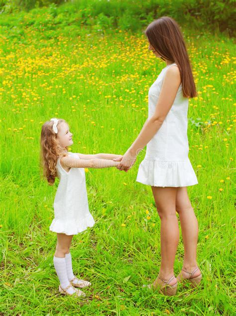 mother and daughter walking and having fun together in
