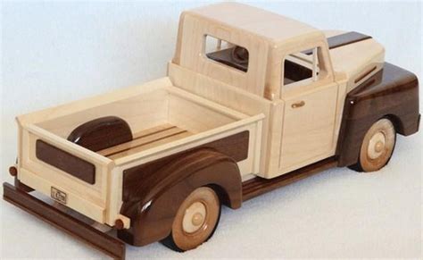 wooden toy truck sitting  top   white surface