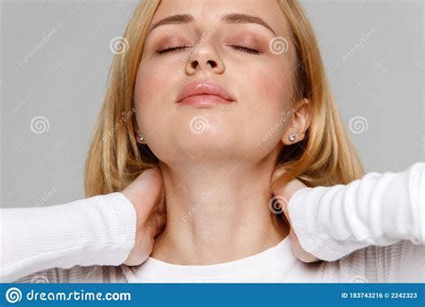 Female Touching Her Pain In Her Neck And Back Feels Pain Massages The