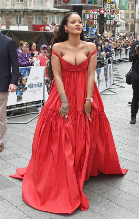 rihanna s ample assets nearly spill out of risque plunging gown at