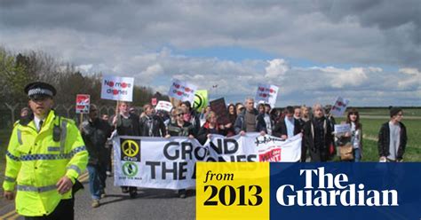 hundreds  anti drone protesters march  uk flight control centre drones military