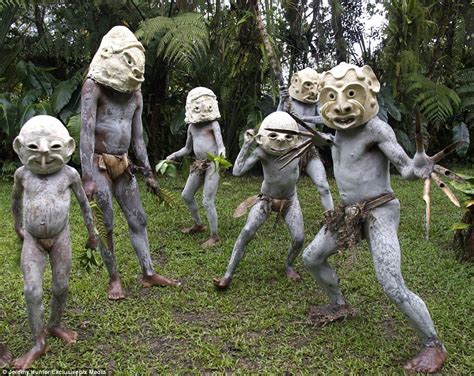 mud men of papua new guinea make a rare appearance in clay masks people papua new guinea