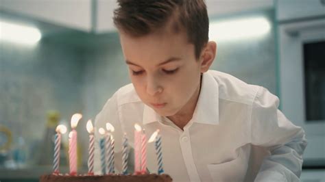 boy blowing candle  birthday cake close  stock footage sbv