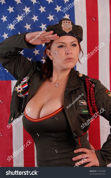 Busty Female In Army Uniform Saluting With American Flag