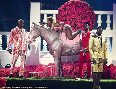 Photos Nicki Minaj Puts Up Sexy Display In Racy Red Dress During Bet