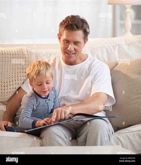 father teaching child  read stock photo  alamy
