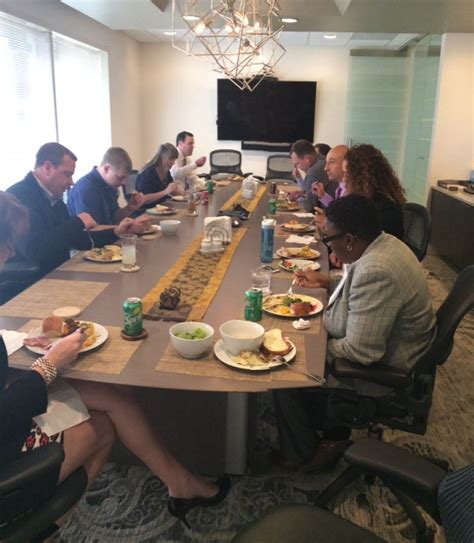 Employees Of The Atlanta Office Join Together At The Table For The