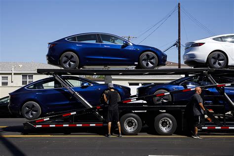tesla revenue  stalling   musk aims  delivery record automotive news