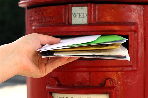 posting  letters  red british postbox  street quickmail