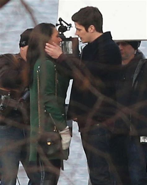 grant gustin and candice patton share a kiss on the flash set 14