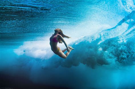 girl diving in beautiful blue lightningsoul media img