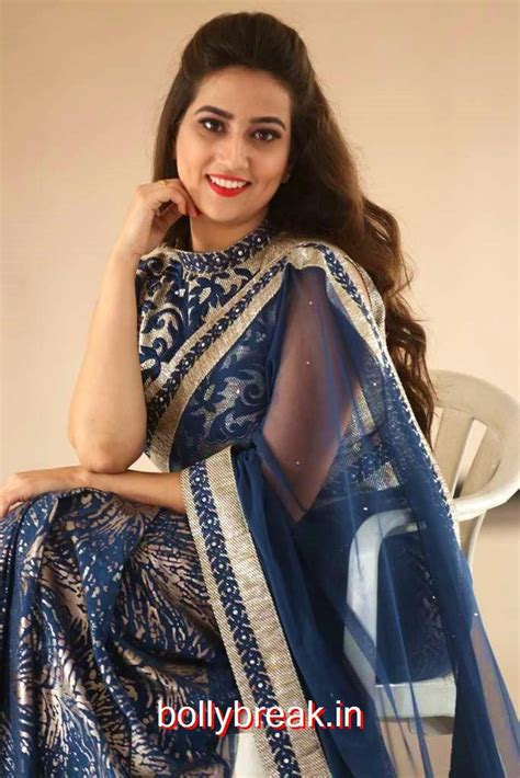 anchor manjusha photo shoot stills in blue saree blue