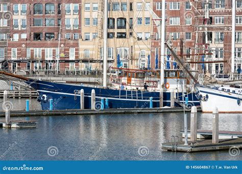 dutch harbor  lelystad  sailing yachts  apartment building editorial photography