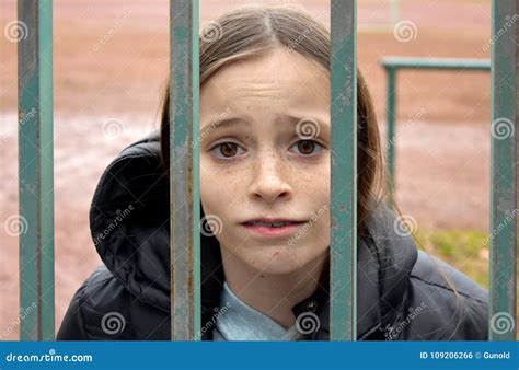 girl locked    fence stock photo image  judgment braces