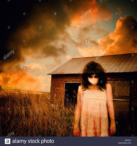 A Scary Ghost Girl Is Wearing A White Dress And An Abandoned House